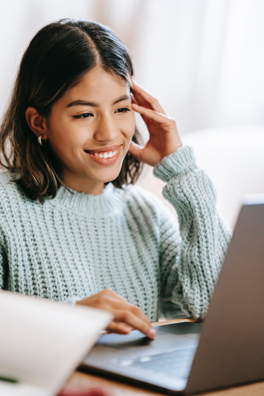 Photo by Liza Summer on <a href="https://www.pexels.com/photo/hispanic-woman-working-remotely-on-laptop-near-notepad-in-apartment-6347901/" rel="nofollow">Pexels.com</a>