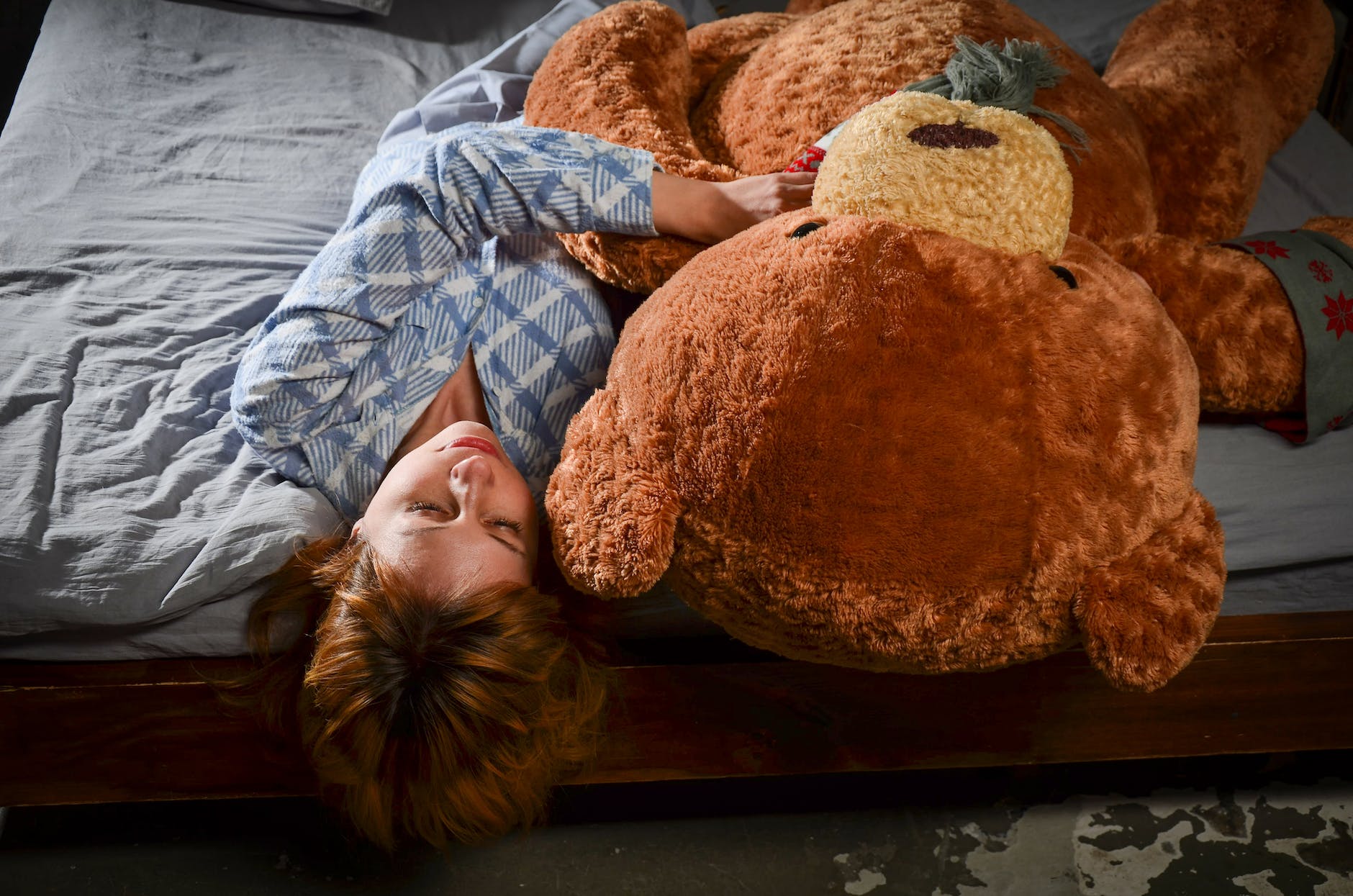 Photo by Victoria Akvarel on <a href="https://www.pexels.com/photo/relaxed-woman-lying-on-bed-with-big-plush-bear-7055799/" rel="nofollow">Pexels.com</a>